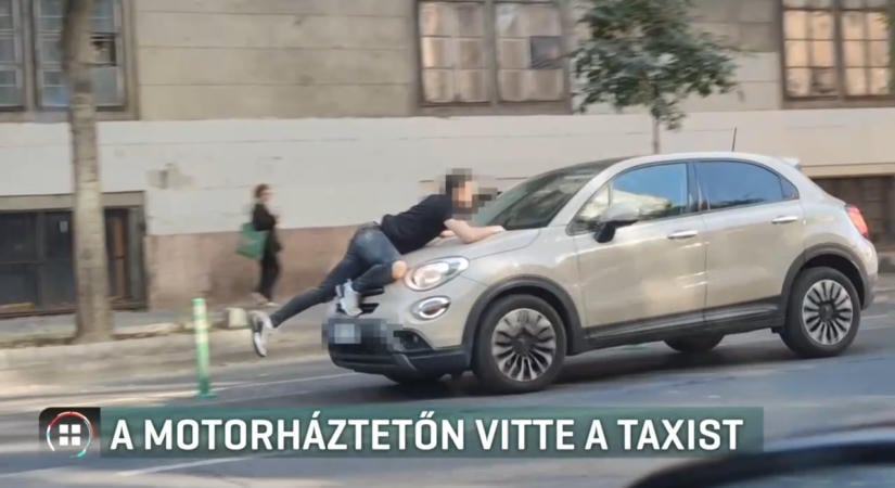 Videón a motorháztetőbe kapaszkodó taxis – közlekedési vita előzte meg a filmbe illő jelenetet