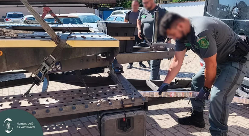 „Cigarettakígyókat” húztak elő a tréler fémvázából a NAV pénzügyőrei – videó